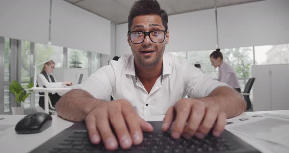 Happy Excited Financial Broker Working on Laptop in Office alt