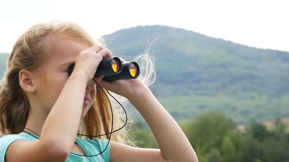 looking with binoculars