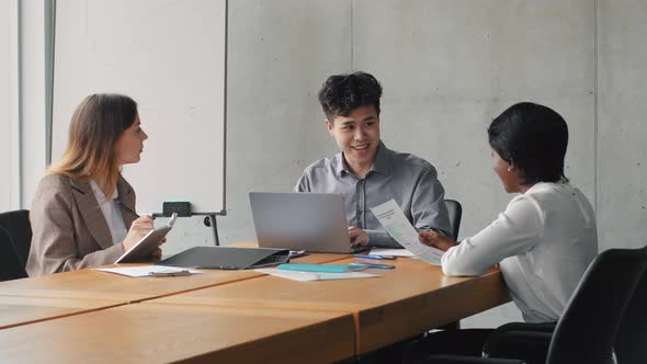 Asian Businessman Boss Leader Sitting at Table with Laptop Discussing Project Strategy Startup with alt