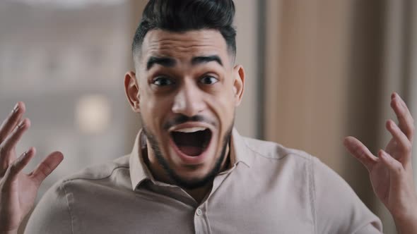 Close Up Shocked Happy Young Hispanic Male Business Man Professional Worker Surprised Looking at alt