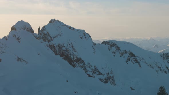 Aerial View From an Airplane of Beautiful Snowy Canadian Mountain Landscape alt