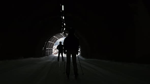Woman Skiing Through Ski Tunnel alt