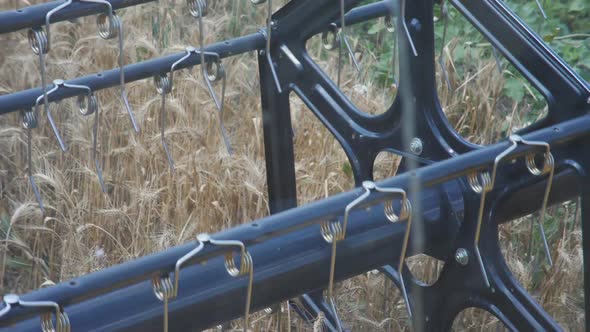 Slow Motion Closeup Threshers Agricultural Combine Harvester Cut Ripe Wheat Ears in Wheat Field alt