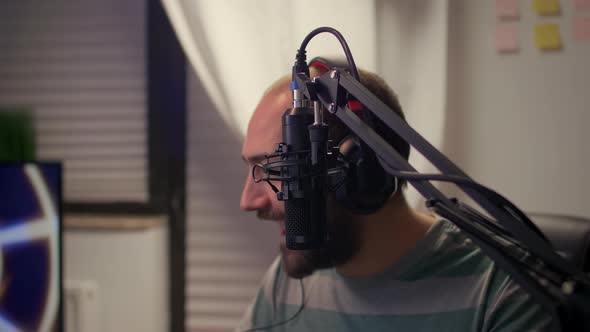 Closeup of Streamer Man Talking Into Microphone alt