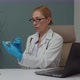 Female Doctor in Protective Gloves Filling Syringe with Vaccine Indoor - VideoHive Item for Sale
