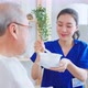 Asian caregiver nurse serve food to senior man while sit on wheelchair. - VideoHive Item for Sale