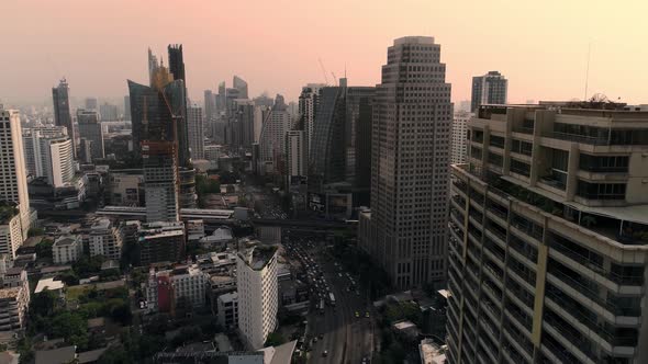 4k Aerial city view of Bangkok dowtnown, Flying over Bangkok, Thailand. alt