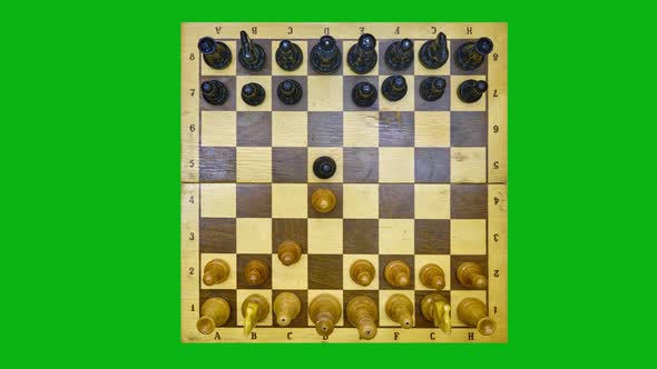 Vintage chess board with a queen gambit opening, stop motion on the green chromakey