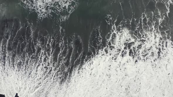 An Aerial View Beautiful Black Sand Volcanic Beach and Giant Waves alt