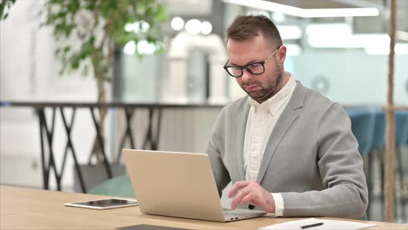 Creative Man Working on Laptop alt