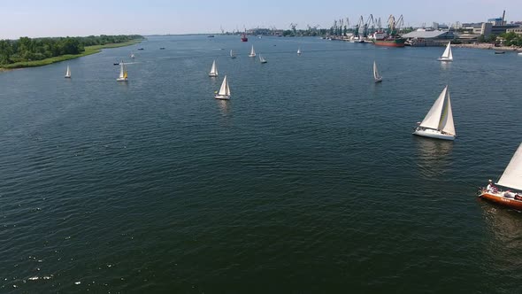 Aerial Shot of Numerous Yachts Sailing in the Dnipro River on a Sunny Day  