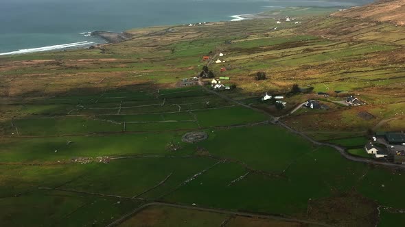 Loher Ringfort, Kerry, Ireland, March 2022. Drone orbits the ancient monument from the south while d alt