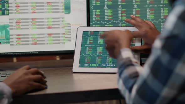 Team of Man and Woman Monitoring Exchange Market Statistics alt