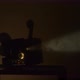 Super-8 film projector in a smoky room
