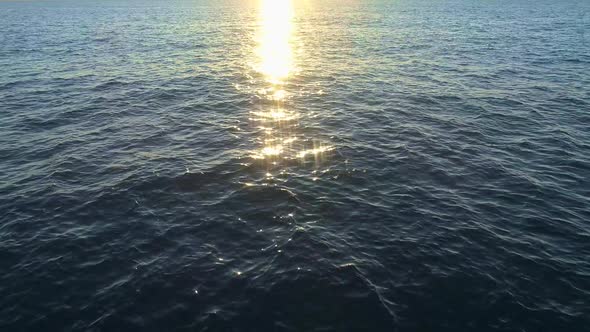 Sunset Over Endless Ocean. Sun Is Reflecting in the Water As a Beautiful Shining Splendor. Aerial alt