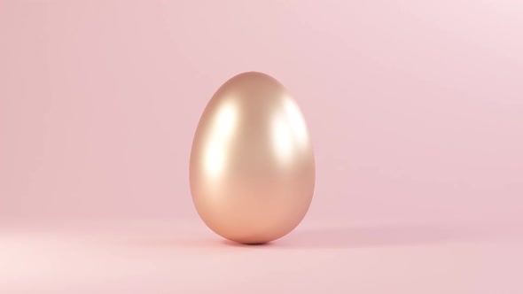 Easter Golden Glitter Egg Swings From Side to Side on Pink Background alt