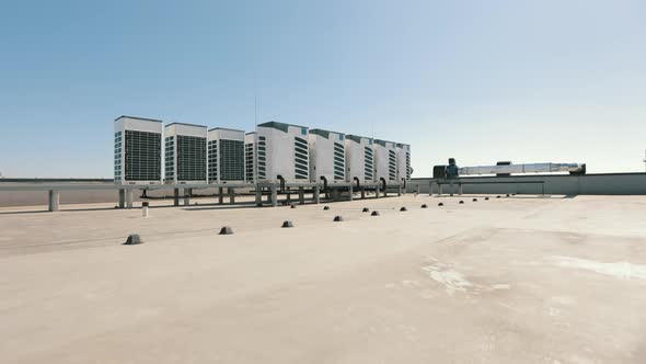 An Air Conditioning System of Two Rows of Air Conditioners is Located on the Roof of the Business