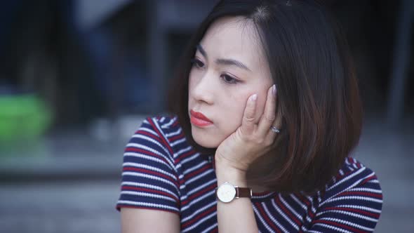 Pensive and worried chinese woman's portrait: worried woman, pensive chinese alt