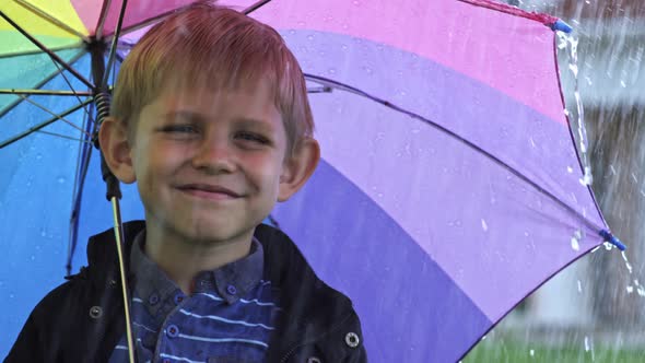 little boy with umbrella posing by pressmaster videohive