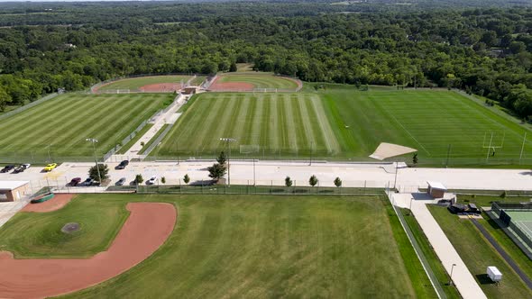 Sports Fields & Baseball Diamond in Grass Landscape - Aerial Drone Overhead View alt