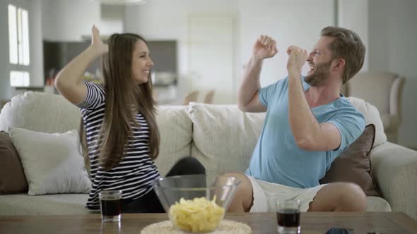 Couple Cheering About Success