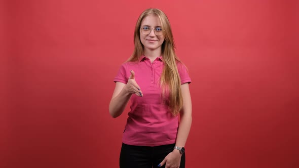 Beautiful Woman Smiling Friendly Offering Handshake As Greeting and Welcoming. alt
