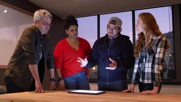 Group of colleagues working in a creative office alt