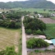 Drone video of a road in a rural village in a mountainous area with green trees in Thailand. - VideoHive Item for Sale