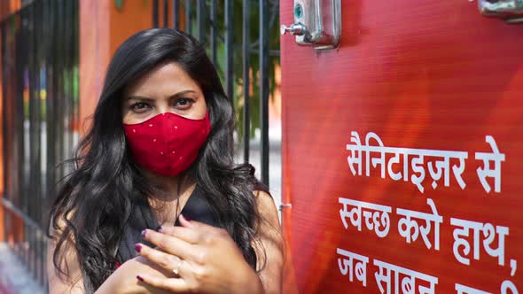 Indian Girl Applying Hand Sanitizer to Stay Safe From Coronavirus