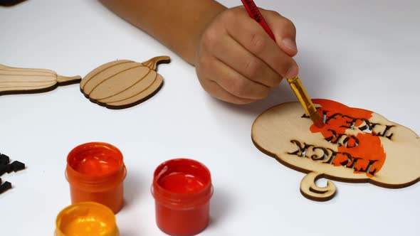 Halloween paints and decor. Children make Halloween decorations with their own hands. alt