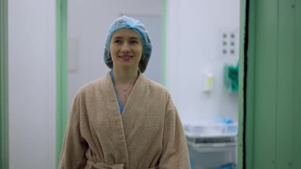 Portrait of Confident Slim Young Caucasian Woman Entering Operating Room Smiling Leaving in Slow alt