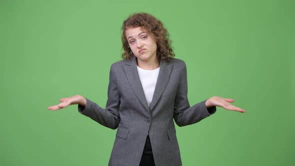 Young Beautiful Businesswoman Shrugging Shoulders alt