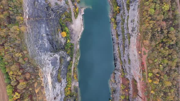 Birdseye Aerial View of Massive Abandoned Limestone Quarry in Czech Republic on Autumn Day. Local - alt