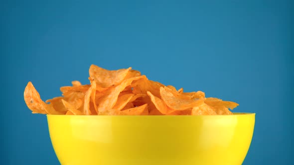 Potato Chips on Rotation Table Blue Background