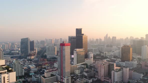 4k Aerial city view of Bangkok dowtnown, Flying over Bangkok, Thailand. alt