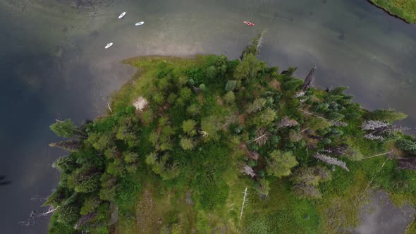 Overhead drone shot of paddleboarders on the crystal clear water of the Payette River in the Idaho w alt