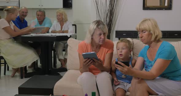 Grandmothers with Electronics and Little Grandson alt