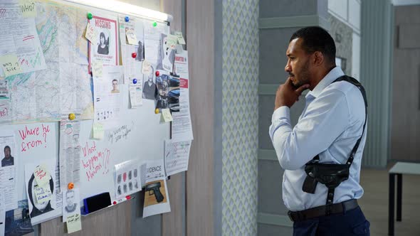 African Detective Investigating a Difficult Case alt