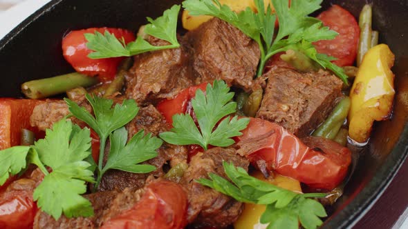 Beef Stew in Frying Pan on Table Close Up View