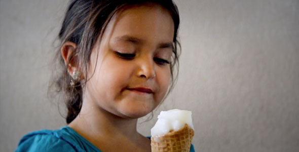 Young Girl Savoring Ice Cream