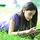 Teenage Girl Using Digital Tablet on Grass - VideoHive Item for Sale