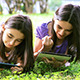 Girls Playing on Digital Tablet and Smartphone - VideoHive Item for Sale