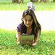 Teenage Girl Using Digital Tablet on Grass 2  - VideoHive Item for Sale