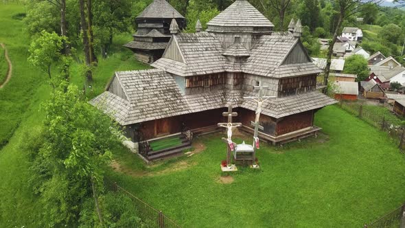 Wooden church in Carpathian, Ukraine. Aerial shot