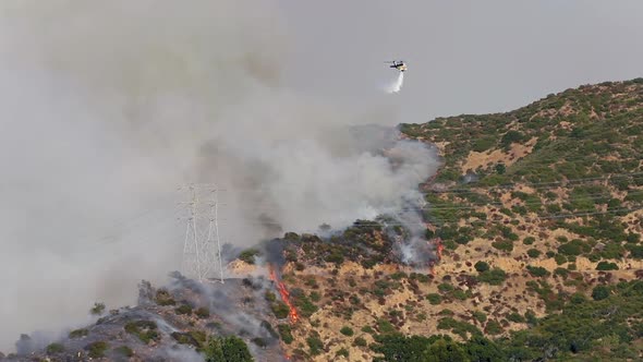 Getty Fire. View Over the Burning Area and a Fire Extinguishing Helicopter alt