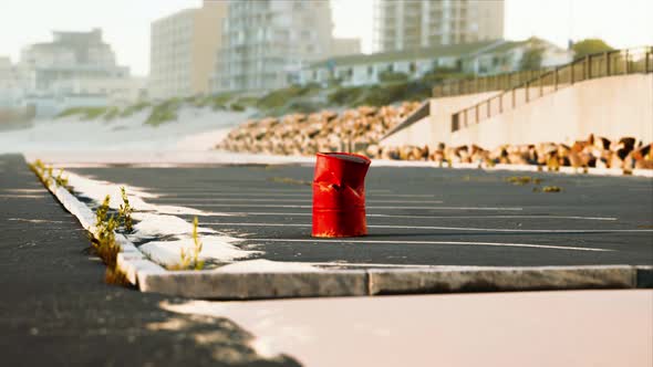 Old and Rusty Metal Barrel on Parking alt