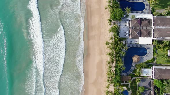 Top view Drone shot for waves passing at Caribbean beach .