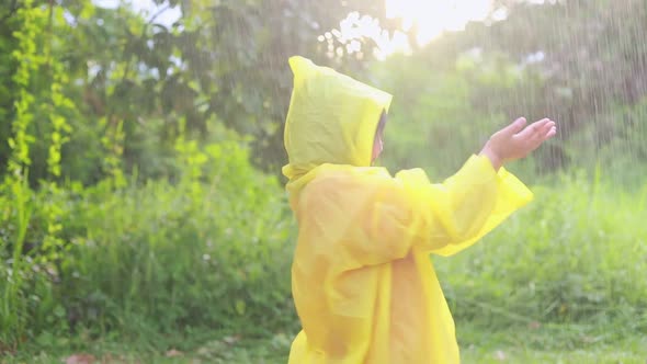 Children asia playing in the rain