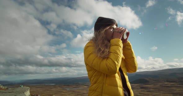 Young Traveller Drink Tea Coffee From Travel Mug alt