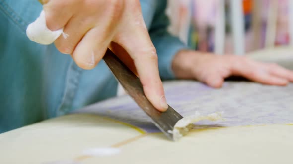 Man making surfboard alt